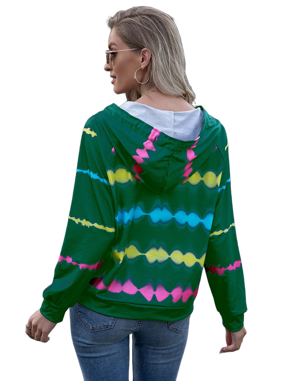 Woman facing away wearing green tie-dye hooded raglan sweatshirt with blue, yellow and pink wave stripes, white hood lining