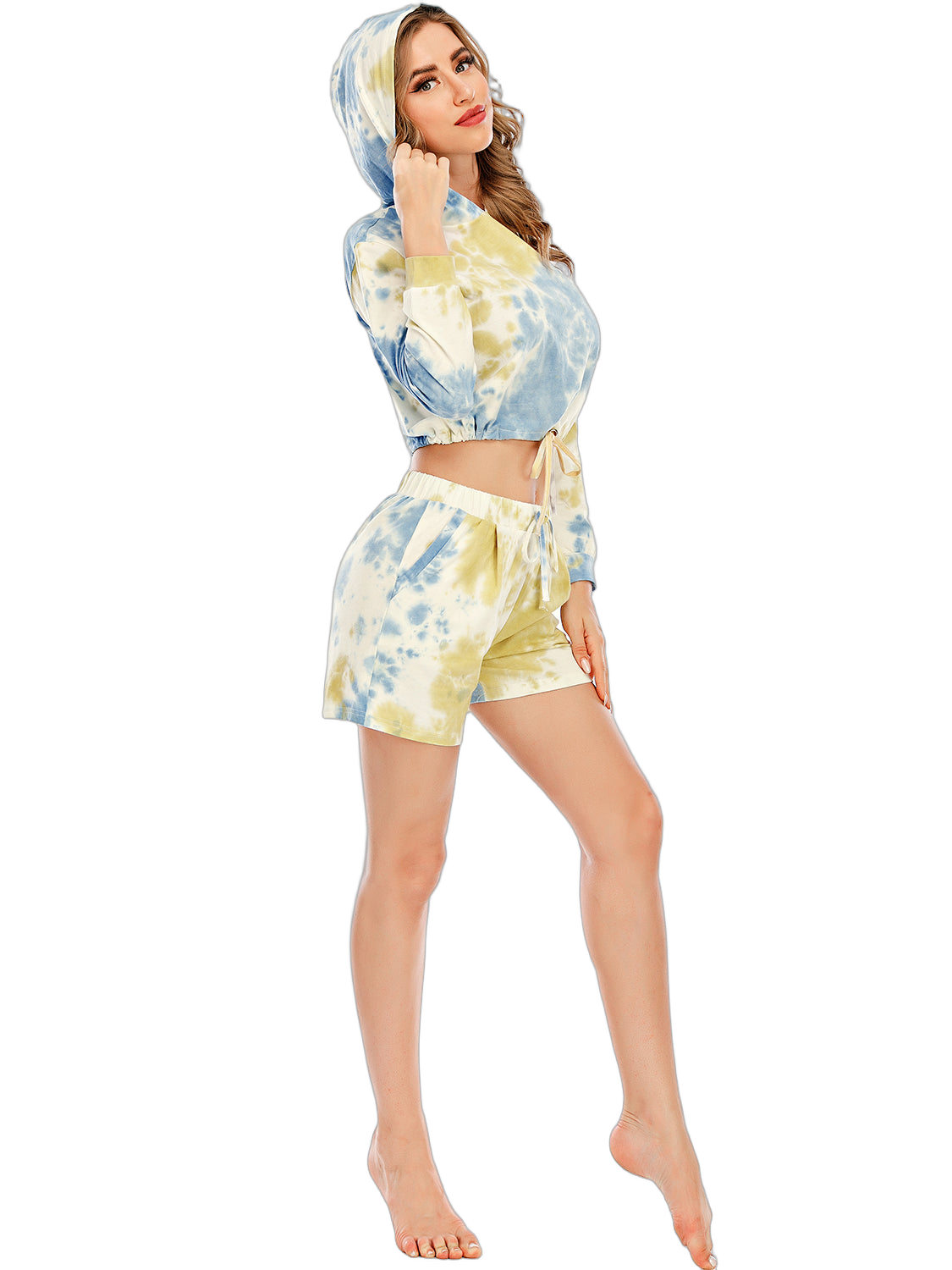 Woman wearing blue and yellow tie-dye cropped hooded top with drawstring and matching drawstring-waist shorts
