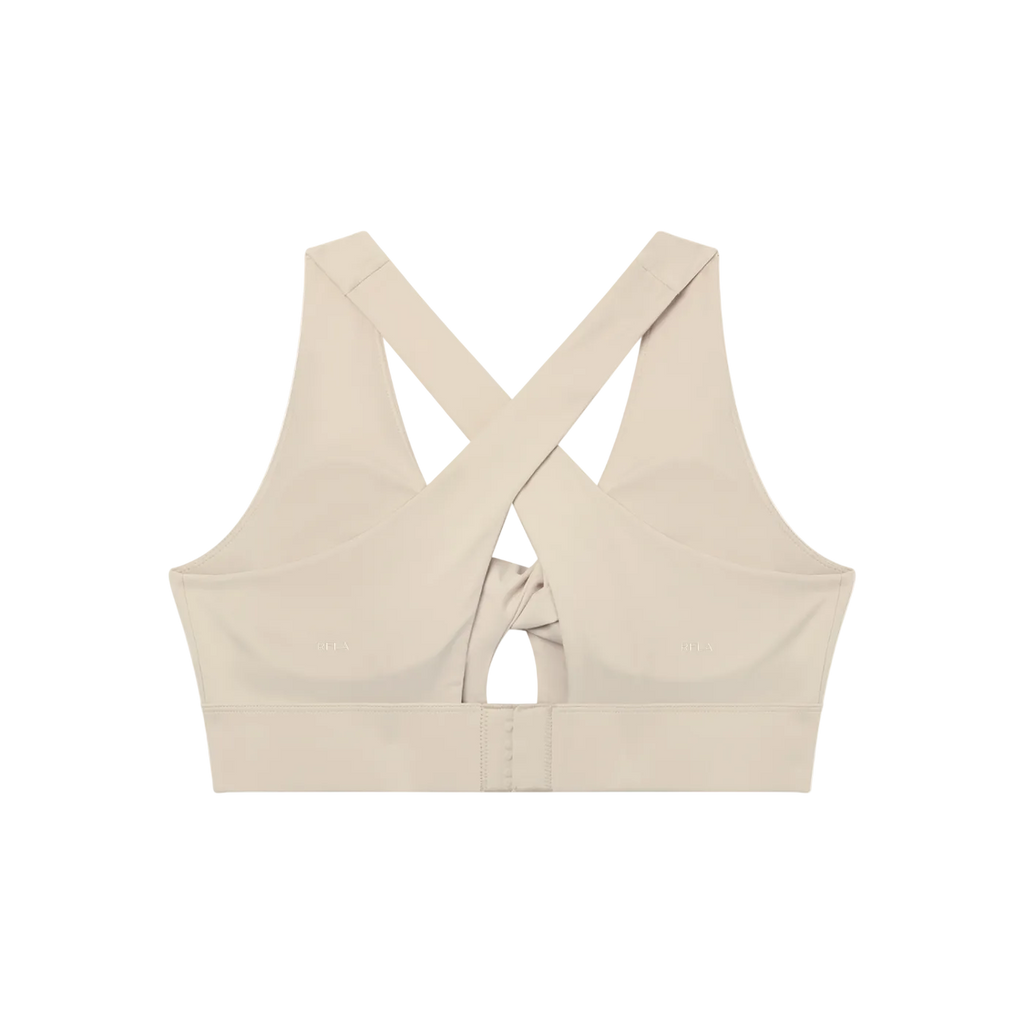 Back view of a sports bra with wide crisscross straps, central twist detail and hook-and-eye closure band