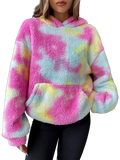Model wearing plush pink, pastel blue and yellow tie-dye hooded sweatshirt with kangaroo pocket and drop shoulders
