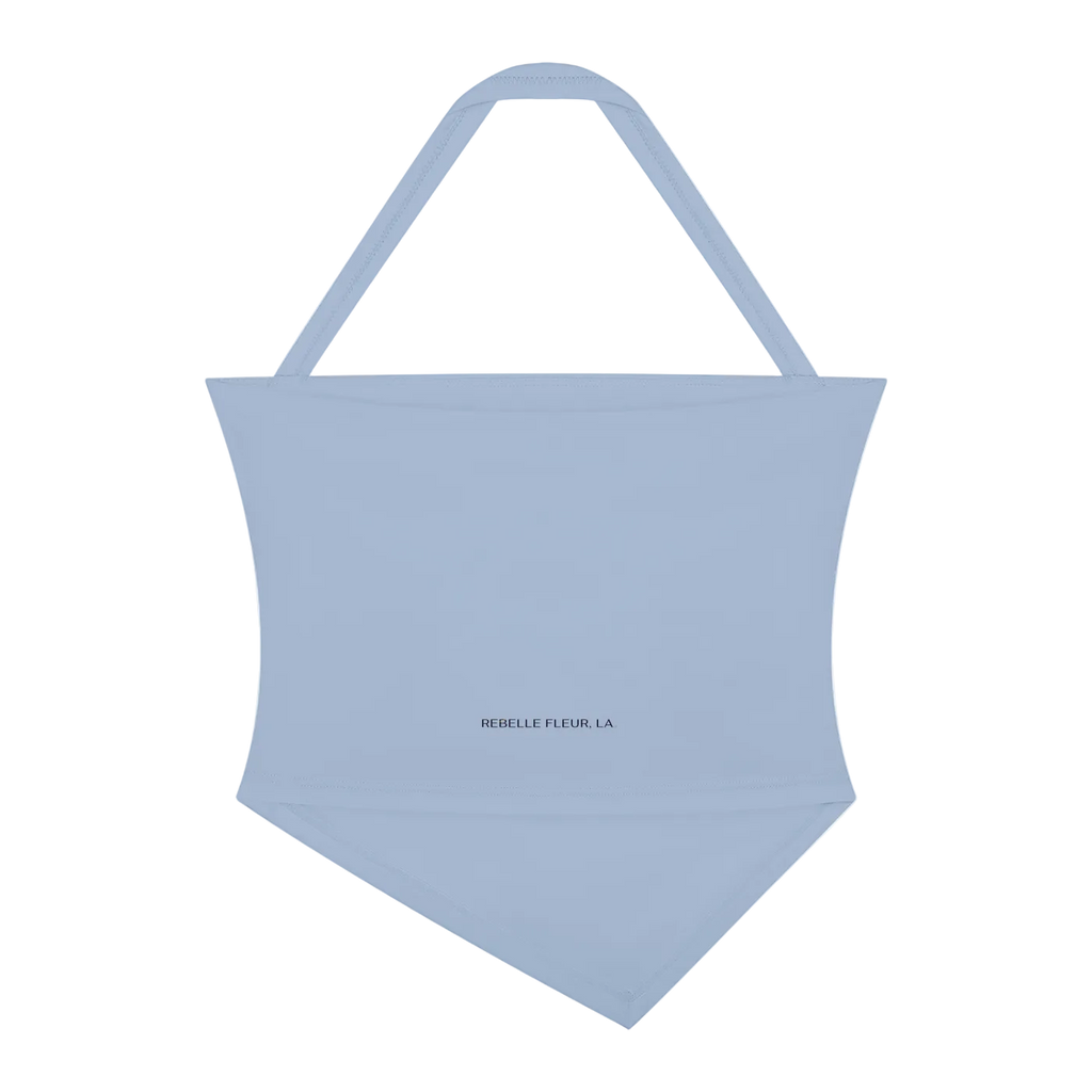 Light blue halter-neck crop tank with pointed triangular hem and small centered 'REBELLE FLEUR, LA' logo.