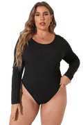 Plus-size model wearing a black long-sleeve round-neck ribbed bodysuit with high-cut leg and gold hoop earrings