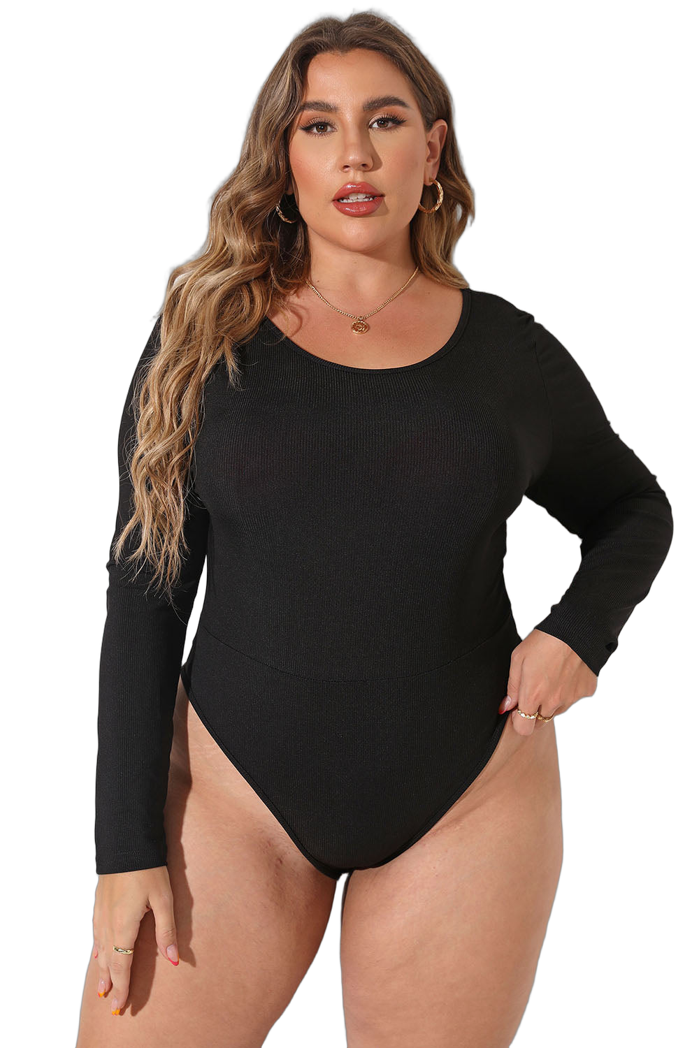 Plus-size model wearing a black long-sleeve round-neck ribbed bodysuit with high-cut leg and gold hoop earrings