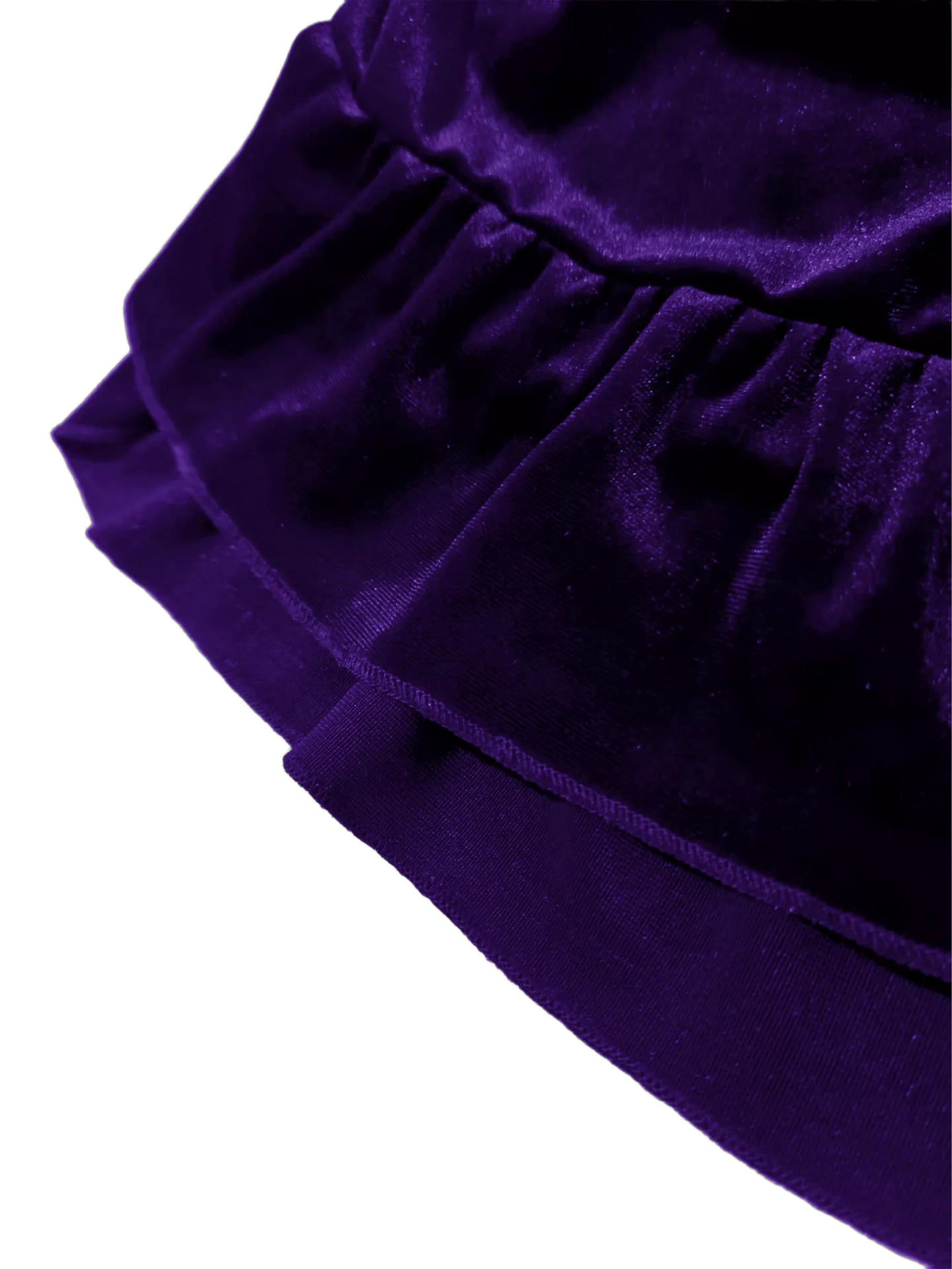 Close-up of ruffled velvet skirt tiers and gathered elastic waistband on dark background