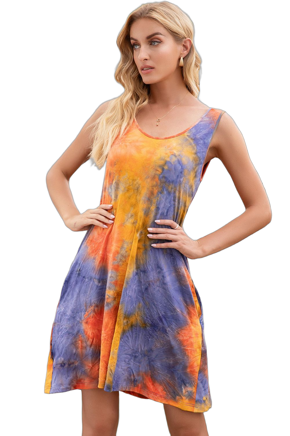 Woman wearing sleeveless tie-dye mini dress with round neckline in orange, blue and yellow, hands on hips.