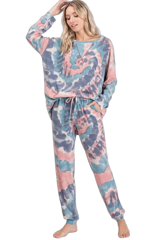 Model in matching pastel pink, blue and gray tie-dye French terry pullover and drawstring pants with pockets
