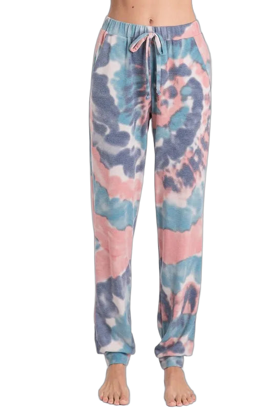 Front view tie-dye French terry jogger pants with drawstring waistband, side pockets and cuffed ankles on bare feet