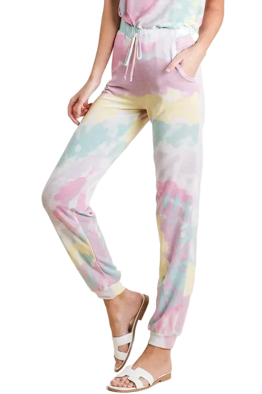 Model wearing pastel tie-dye French terry jogger pants with drawstring waist, side pockets and cuffed ankles