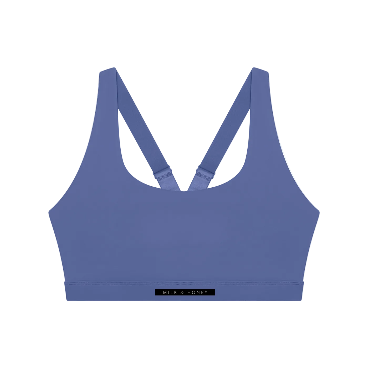 Scoop-neck sleeveless sports bra with adjustable crossed straps and narrow underband labeled 'MILK & HONEY'.