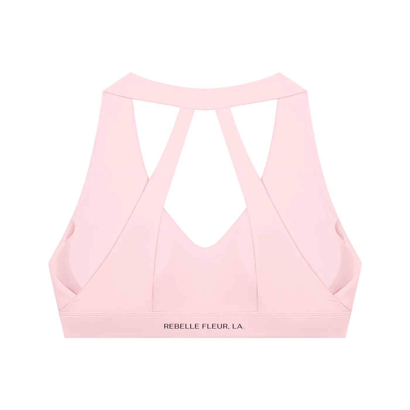 Light pink cropped sports bra with wide crisscross back straps and 'REBELLE FLEUR, LA.' printed on the band