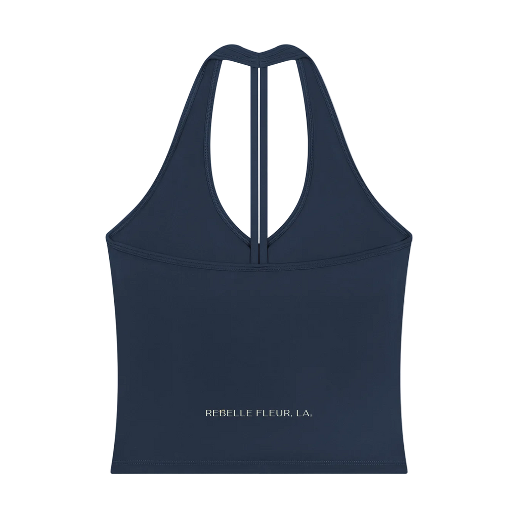 Halter-style V-back tank top with narrow center racerback strap and 'REBELLE FLEUR, LA.' logo near hem