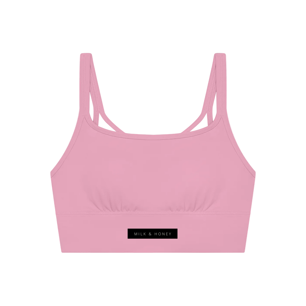 Pink cropped tank with narrow double shoulder straps and a black "MILK & HONEY" label at center front