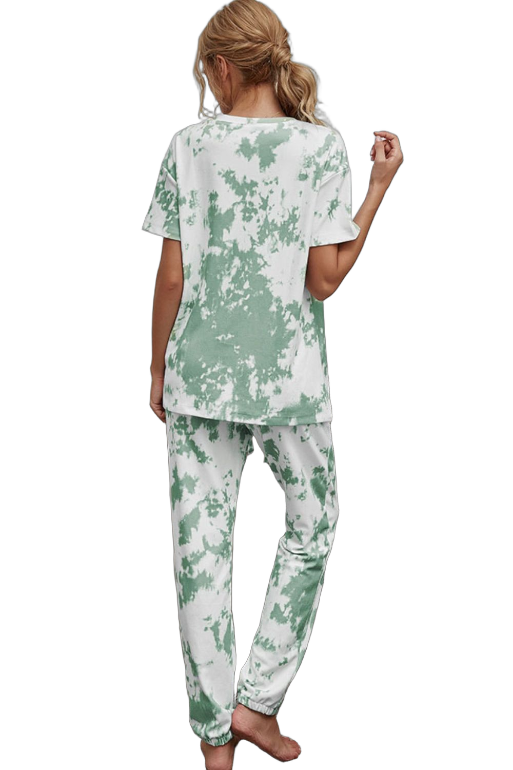 Back view of woman wearing green-and-white tie-dye short-sleeve tee and matching jogger pants with elastic ankle cuffs