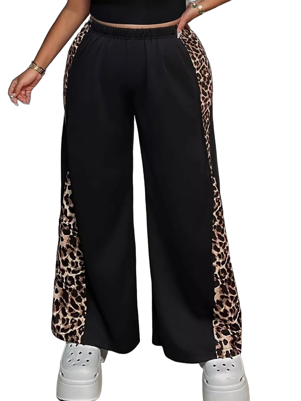 Black wide-leg pants with leopard-print side panels and elastic waistband; white platform shoes visible