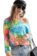 Multicolor tie-dye long-sleeve soft-knit top with off-shoulder neckline, tucked into light-wash jeans, black cap