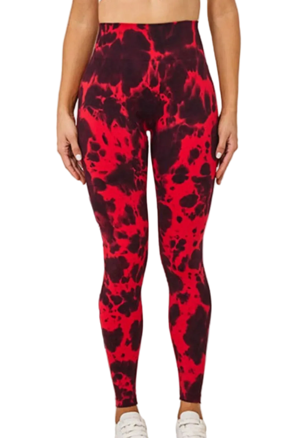 High-waist tie-dye leggings with red and black splotches, model cropped at midriff wearing white sneakers