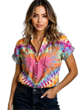 Short-sleeve tie-dye button-up shirt with chest pockets and rolled cuffs, tucked into dark jeans