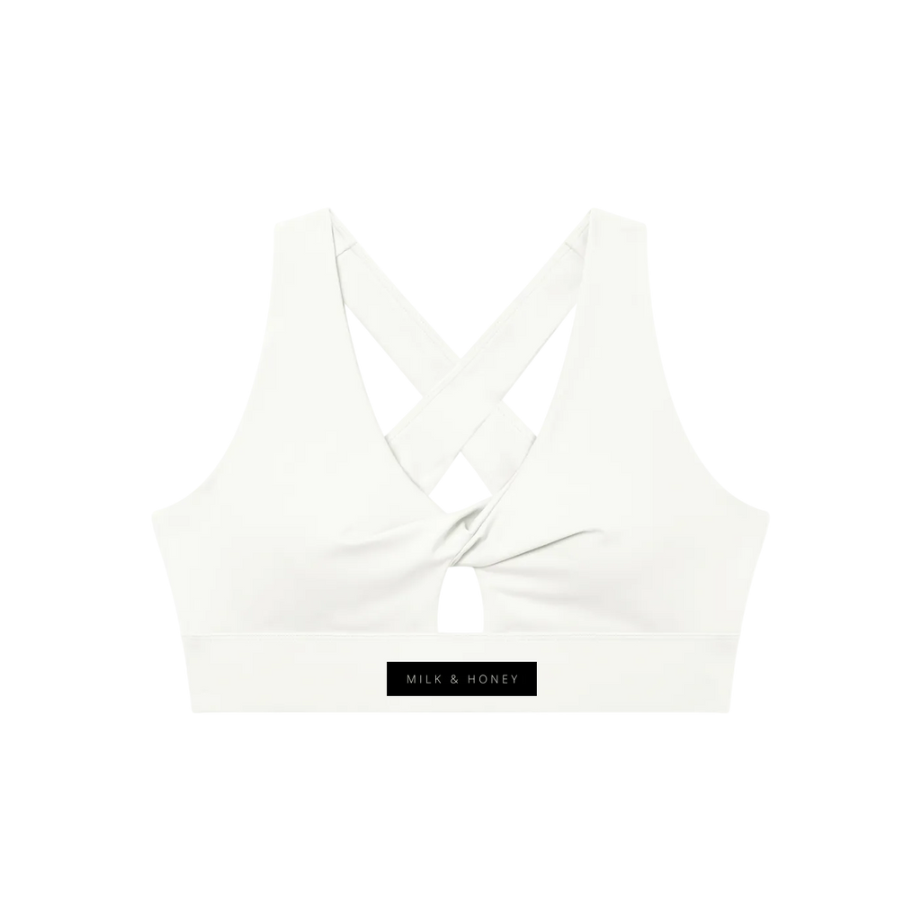 Sports bra back with crisscross straps, twist-front center, small keyhole above elastic band and 'MILK & HONEY' label