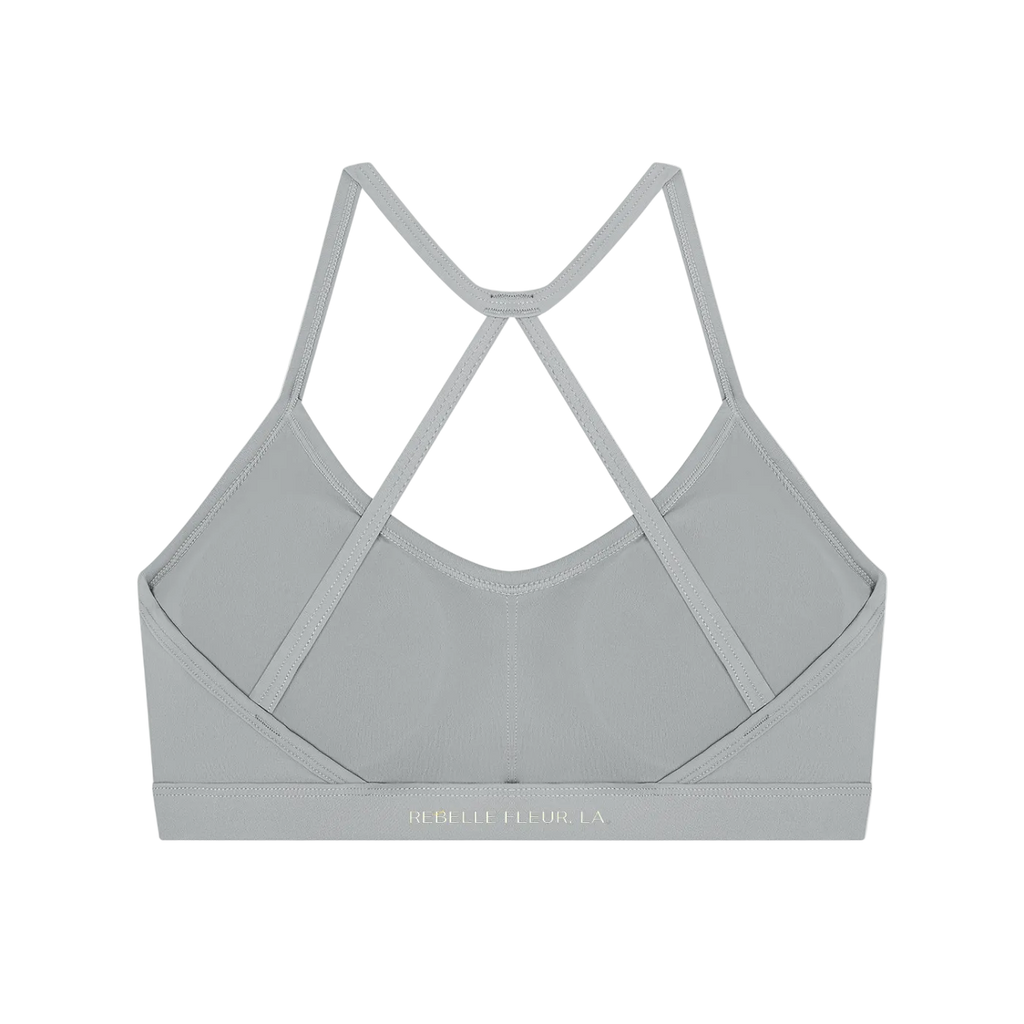 Gray sports bra back with narrow crisscross straps and elastic band showing REBELLE FLEUR LA logo