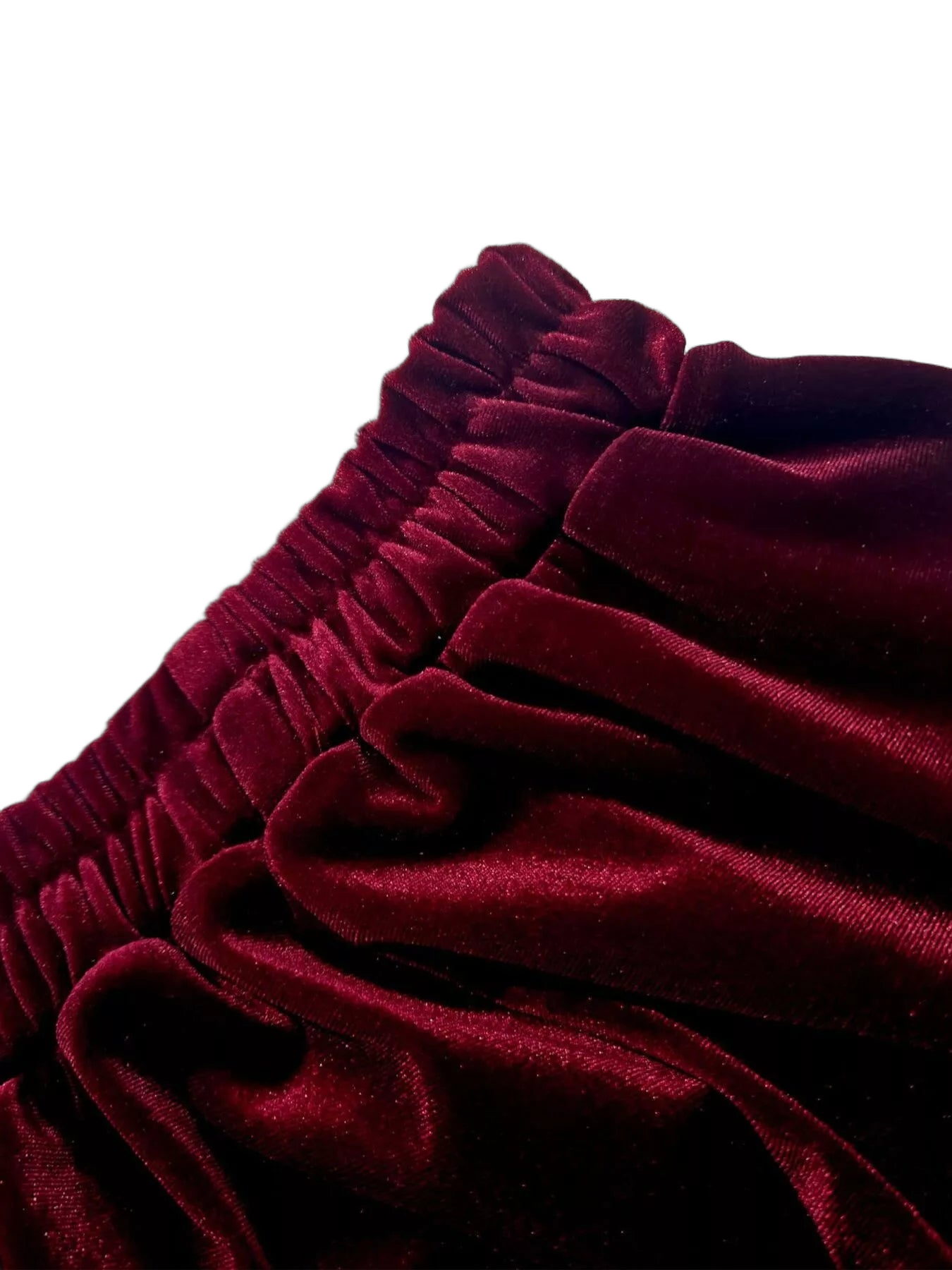 Burgundy velvet skirt close-up showing elastic ruffled waistband and gathered fabric