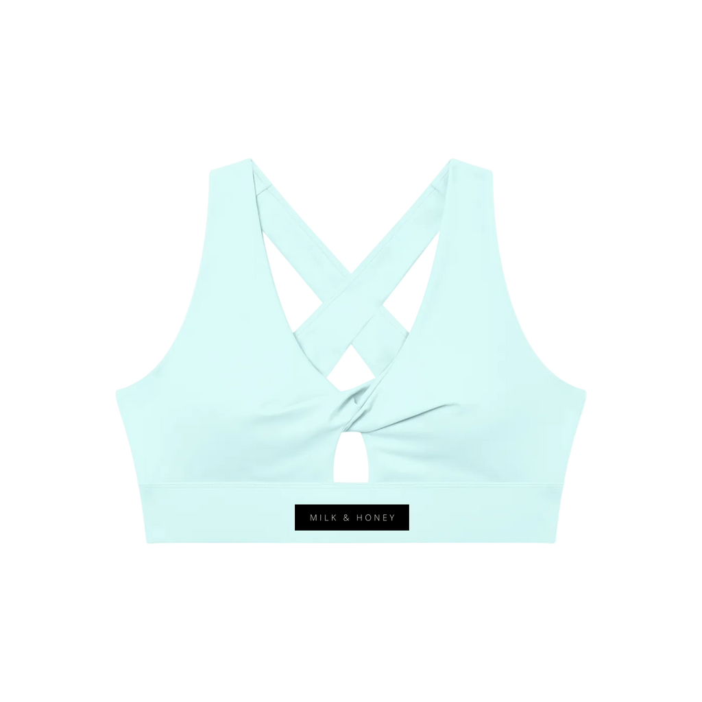 Twist-front sports bra with crisscross back straps, center keyhole and MILK & HONEY label
