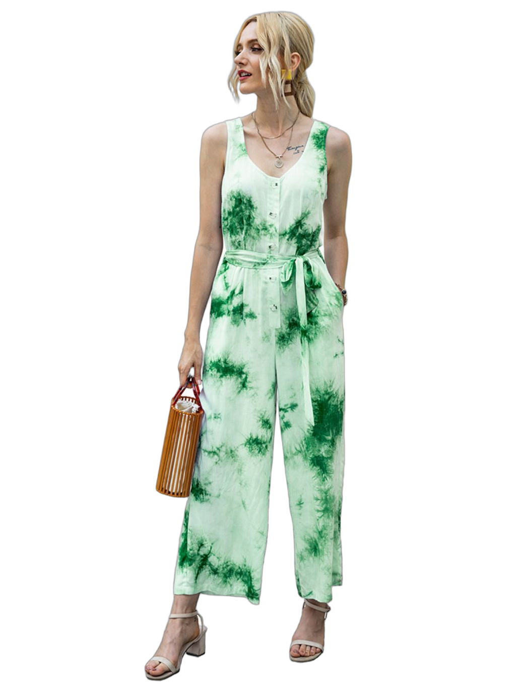 Sleeveless green tie-dye jumpsuit with scoop neckline, button front and self-tie waist; model holds wooden bag