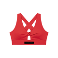 Red twist-front sports bra with crisscross back, small front keyhole and wide elastic band labeled "MILK & HONEY"