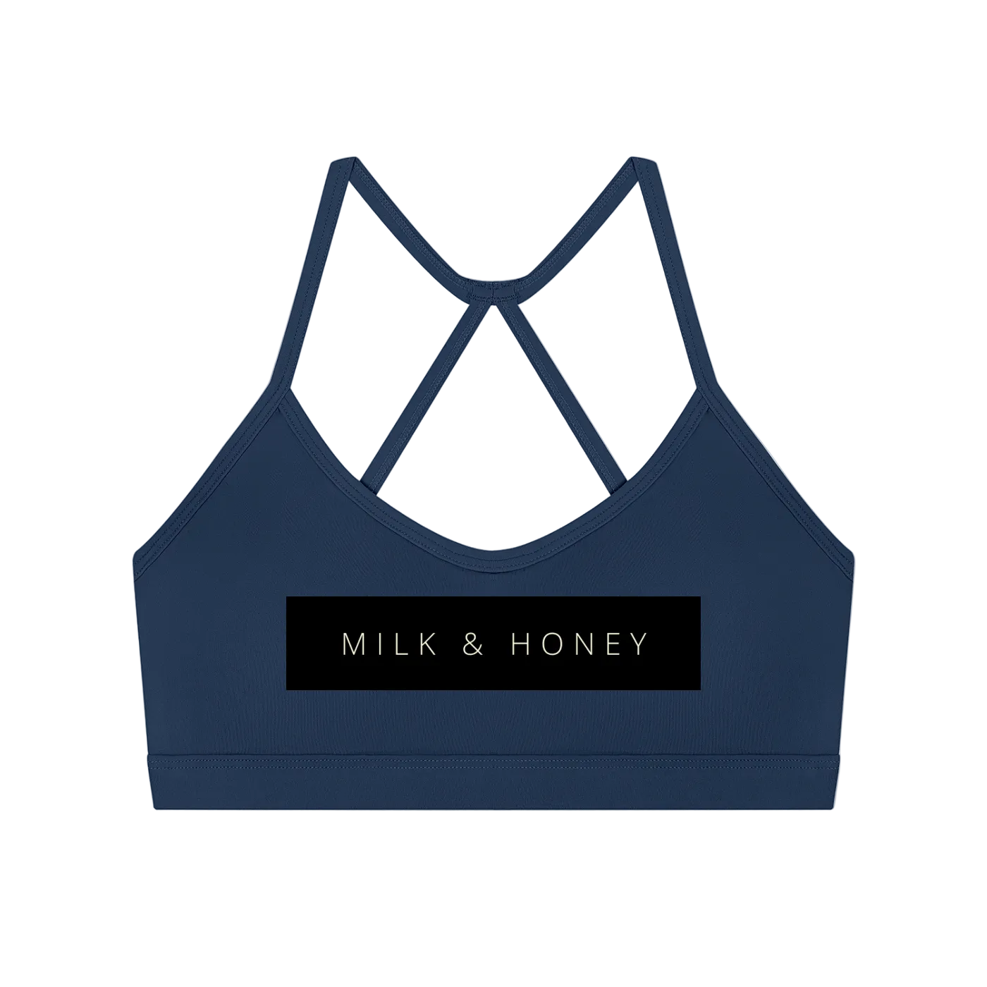 Navy sports bra with thin crisscross back straps and black rectangular 'MILK & HONEY' logo panel