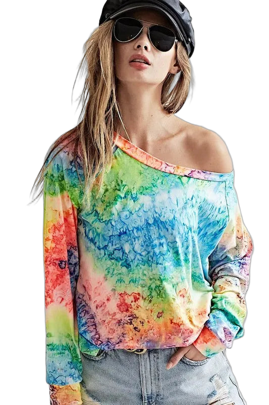 Model wearing multicolor tie-dye off-shoulder long-sleeve top with light distressed denim, black cap and sunglasses