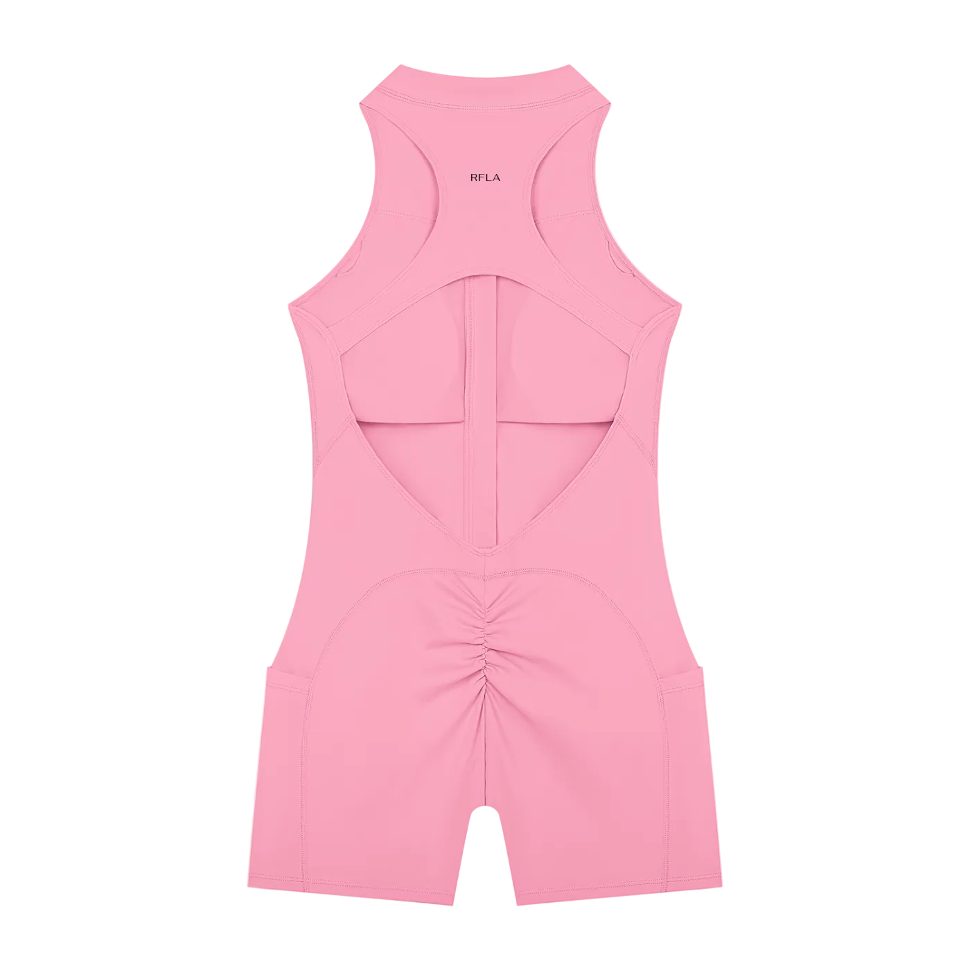 Pink sleeveless racerback romper laid flat with open back cutout, central vertical strap and ruched back seam, short…