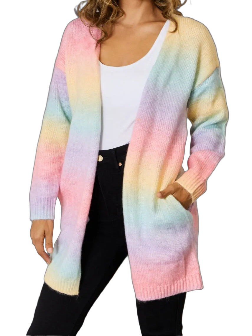 Model wearing pastel gradient open-front long cardigan with pockets, ribbed cuffs and hem over a white tank and black pants