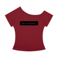 Wine-red off-the-shoulder T-shirt with short sleeves and black rectangular chest print reading 'MILK & HONEY'