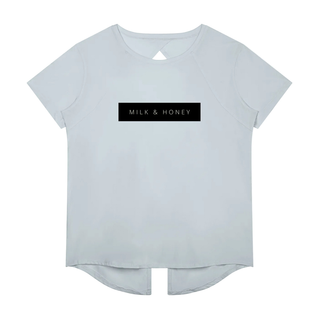 Short-sleeve crew T-shirt with black 'MILK & HONEY' chest print and curved high-low hem with center slit