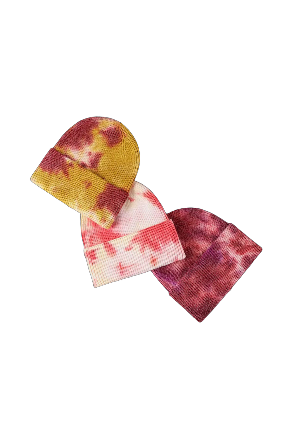 Three cuffed rib-knit tie-dye beanies in yellow-red, white-pink, and maroon tones on a black background