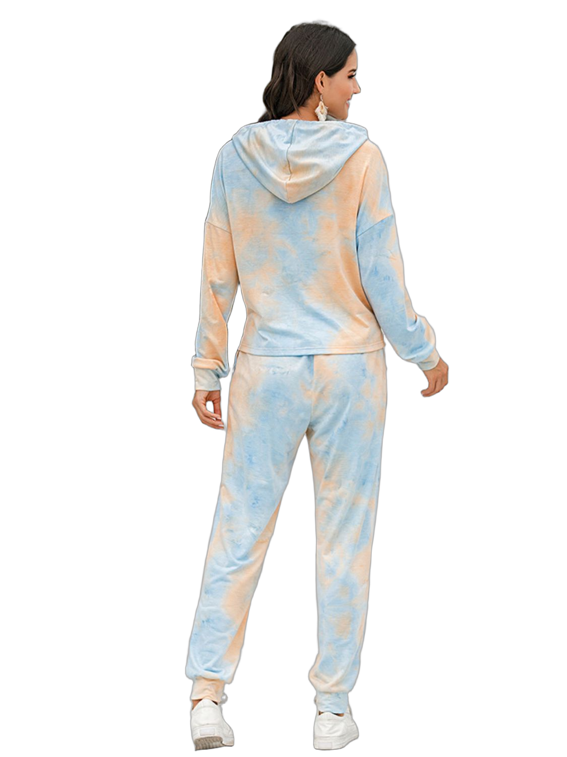 Back view of model wearing a pastel tie-dye hooded sweatshirt and jogger pants with cuffed ankles and white sneakers