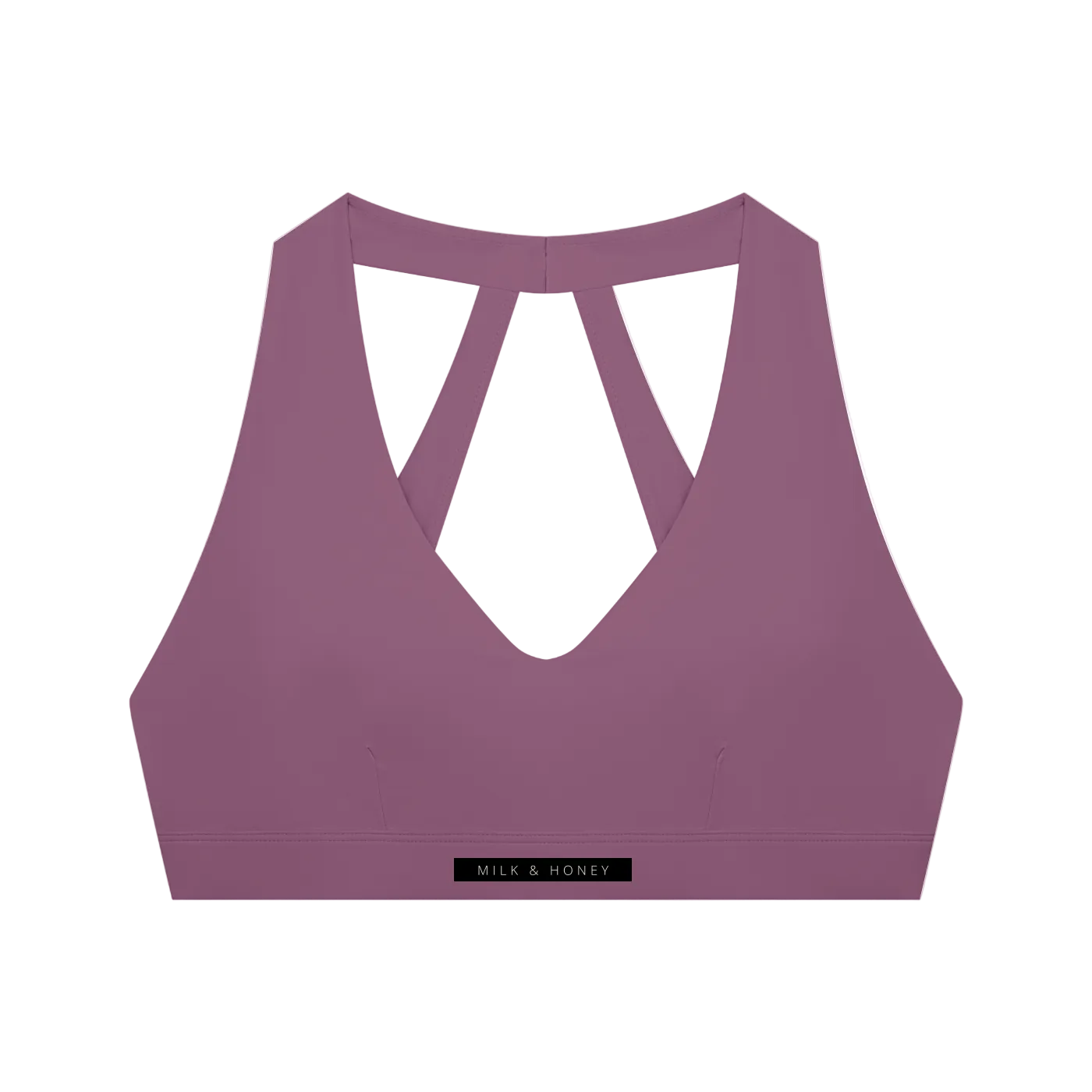 Plum purple cropped sports bra with deep V-front, crossed-back straps and elastic underband labeled 'MILK & HONEY'.