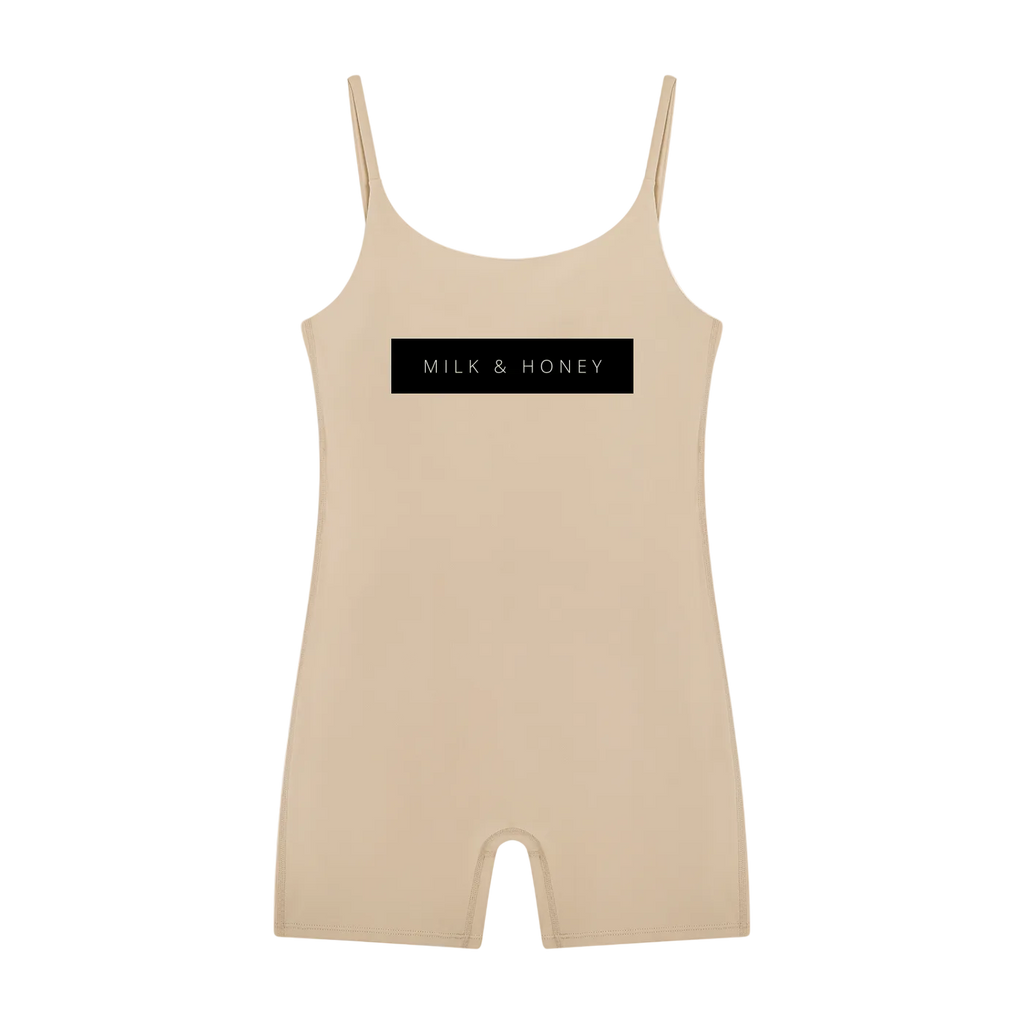 Khaki sleeveless U-neck romper with thin straps and centered black 'MILK & HONEY' rectangular logo on front.