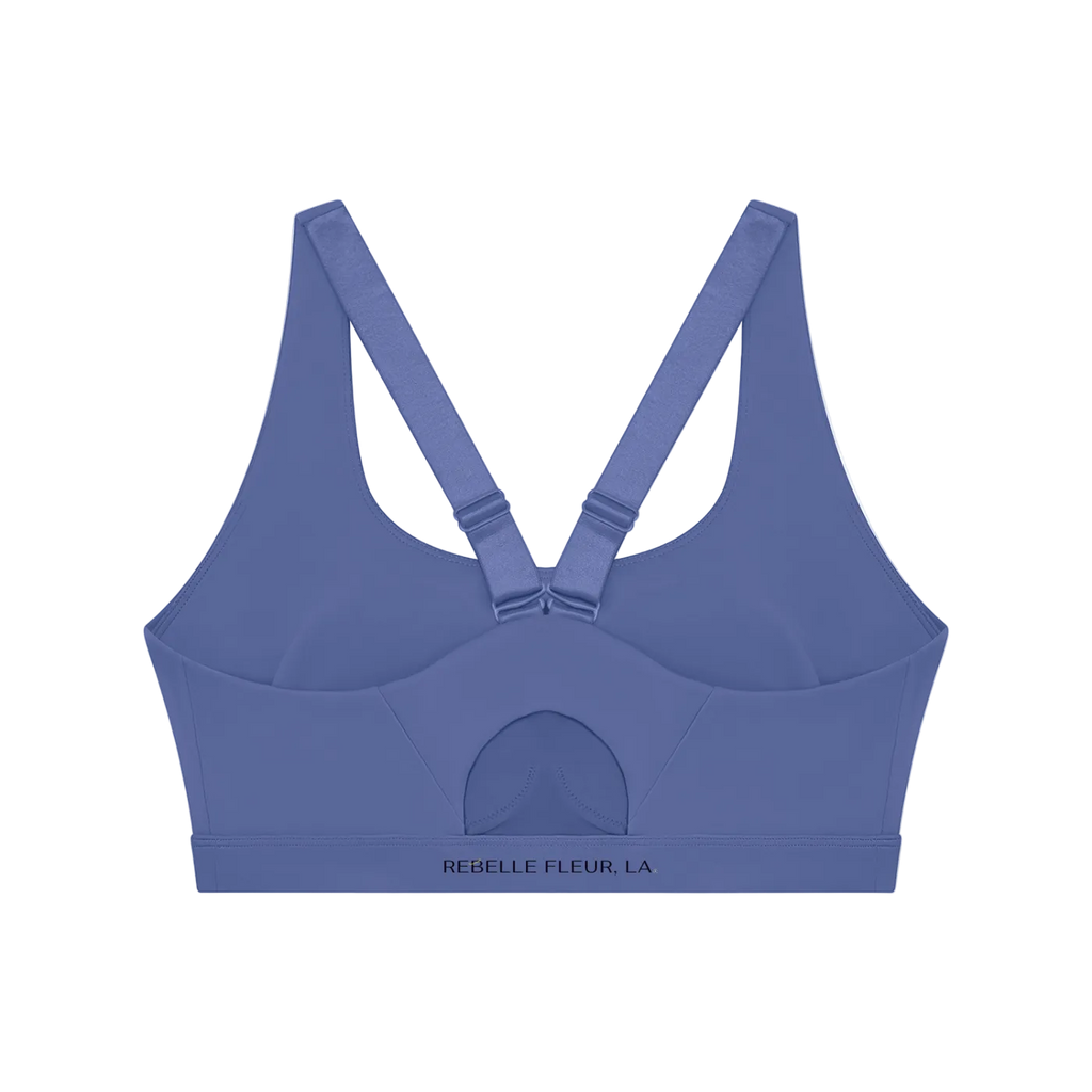 Back view of blue-violet sports bra with adjustable crisscross straps, molded cups and branded elastic band
