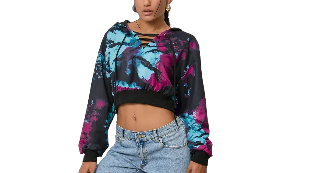 Cropped tie-dye hoodie with lace-up V-neck, long sleeves and black ribbed hem; worn with light-wash jeans.