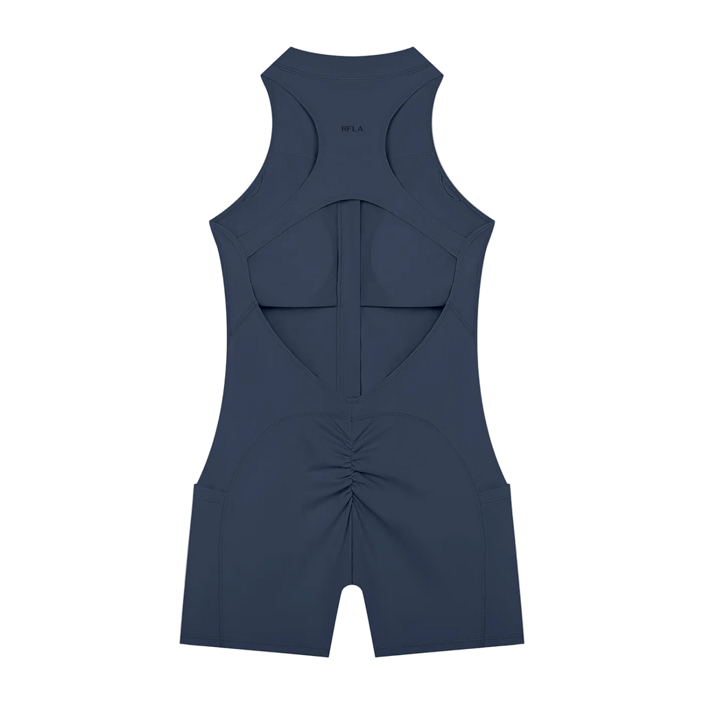 Back of sleeveless romper with large racerback cutout, vertical center seam and ruched back detail
