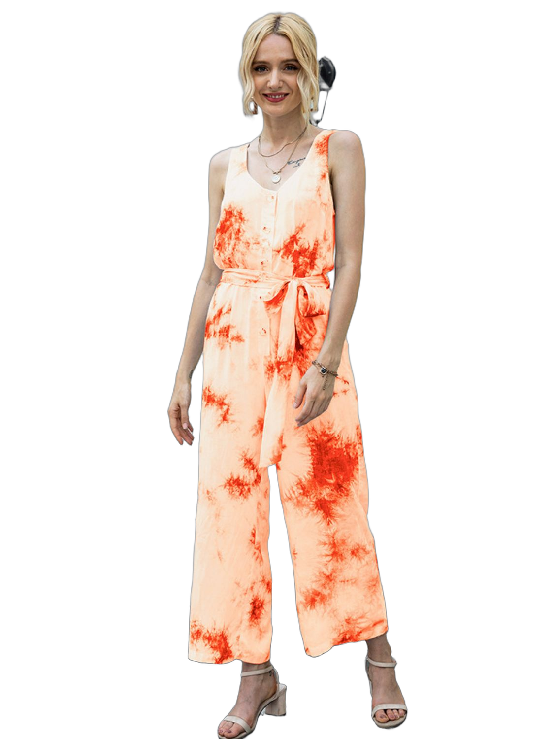 Model wearing orange tie-dye sleeveless jumpsuit with button front, self-tie waist and wide cropped legs.