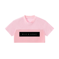 Pink cropped V-neck short-sleeve top with two-panel texture and black rectangular 'MILK & HONEY' logo