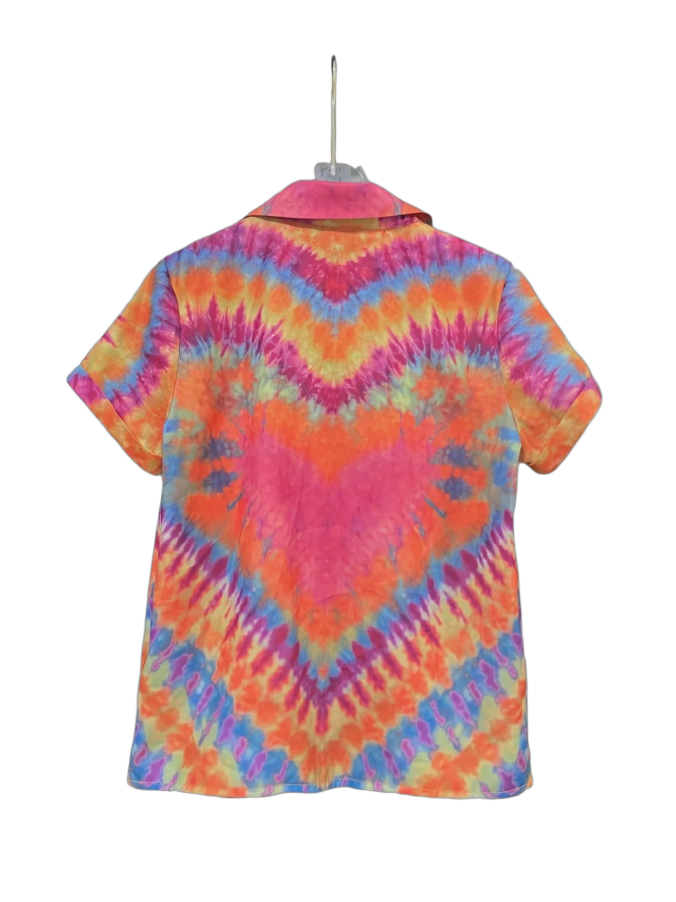 Back of short-sleeve button-up shirt on hanger with pink, orange, blue and yellow tie-dye chevron pattern