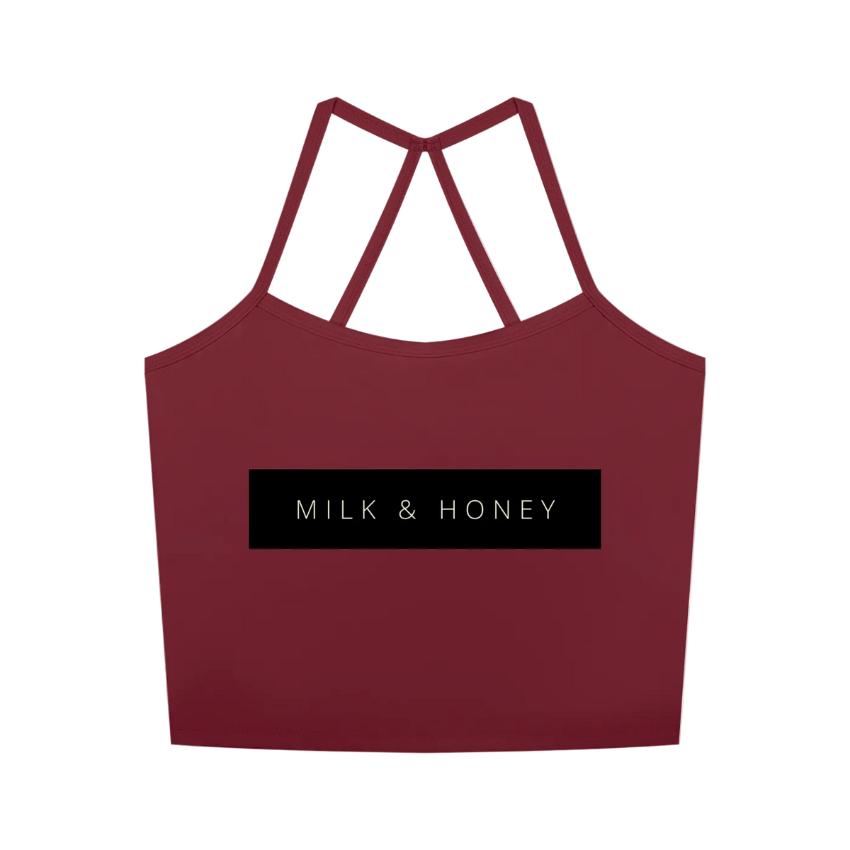 Cropped red tank with thin crossed racerback straps and centered black rectangle reading 'MILK & HONEY'.