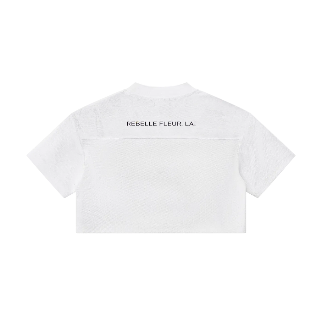 White cropped short-sleeve top back view with 'REBELLE FLEUR, LA' printed on upper back