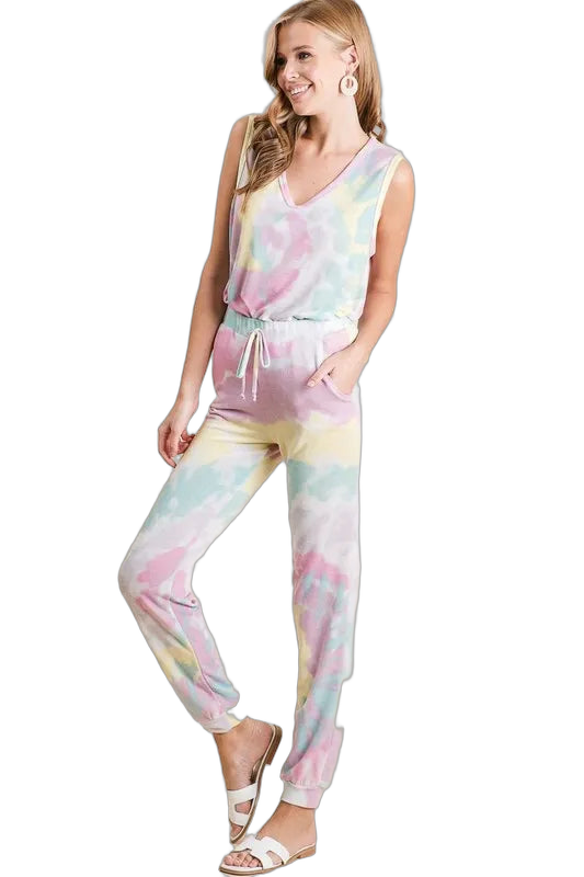 Model in pastel tie-dye drawstring jogger pants with pockets and cuffed ankles, sleeveless V-neck top
