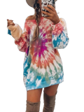 Off-shoulder long-sleeve tie-dye mini dress with pink, blue and orange swirl and over-the-knee boots