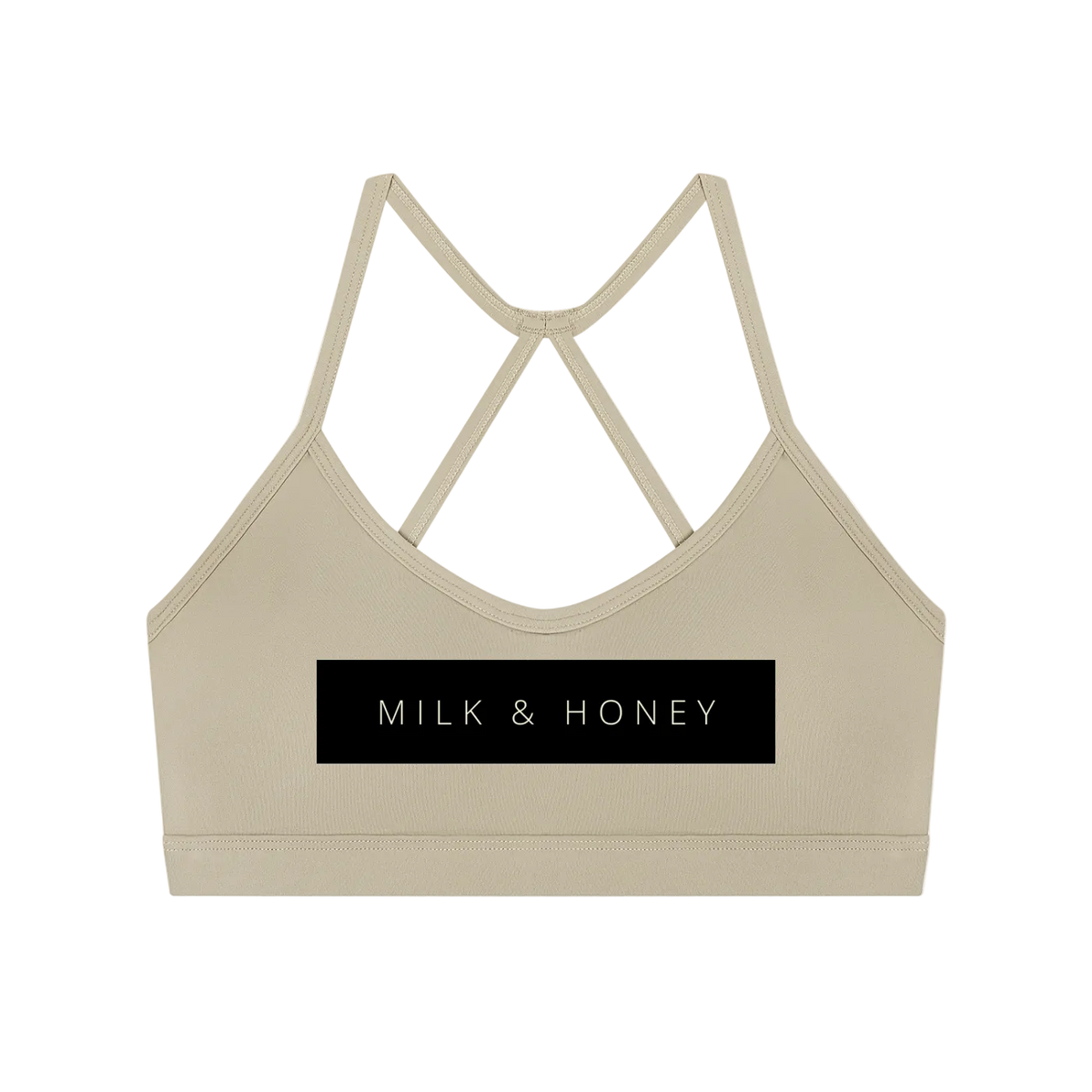 Cropped sleeveless sports bra with thin crisscross back straps and rectangular 'MILK & HONEY' print on front