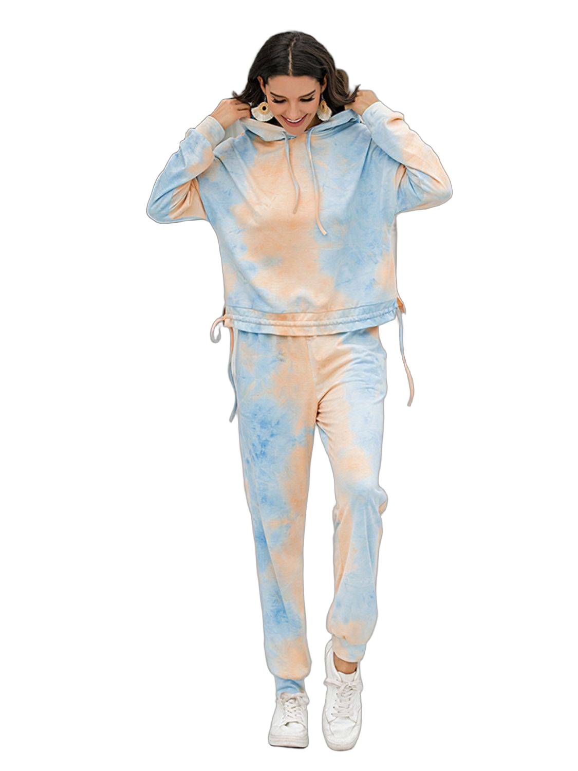 Tie-dye hoodie and jogger set in light blue and peach, hood with drawstrings, cuffed ankles, paired with white sneakers
