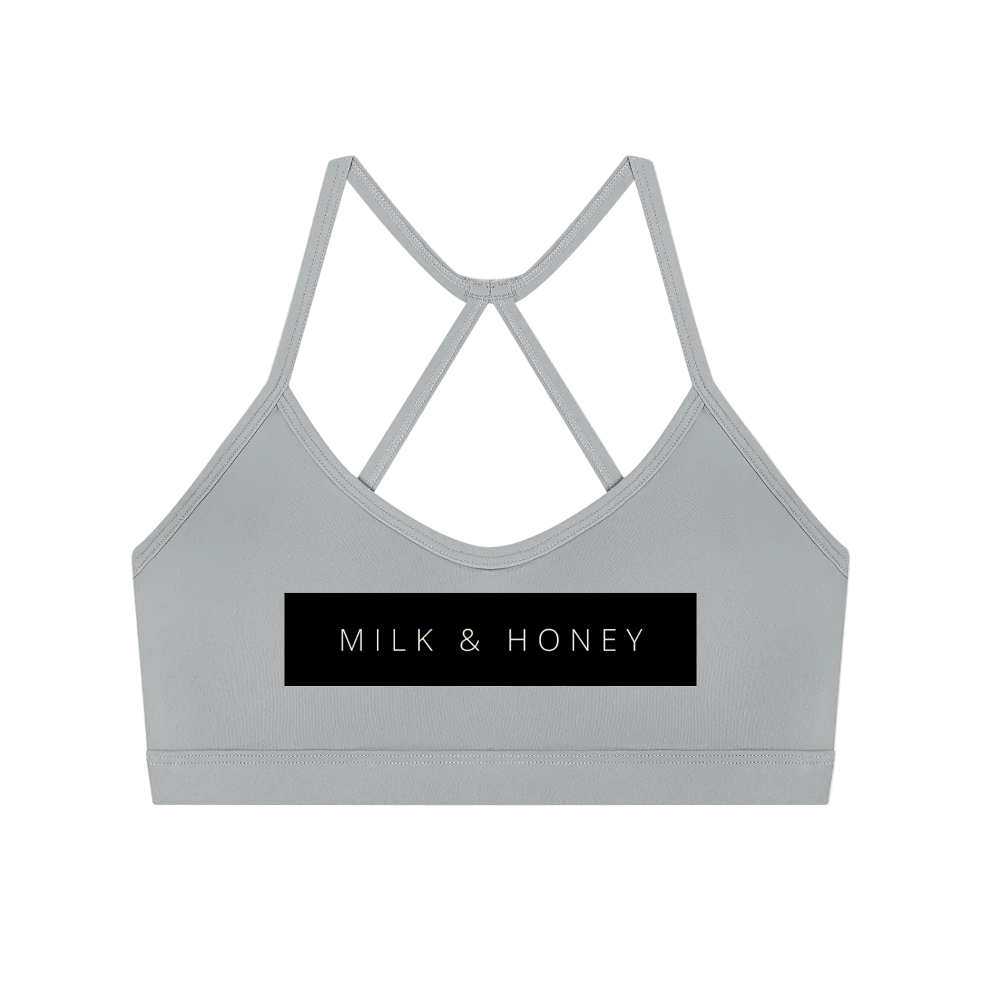 Gray crop sports bra with thin crisscross back straps and black MILK & HONEY rectangular logo panel